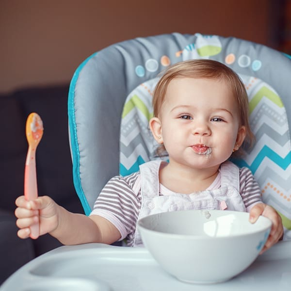 baby eating with spoon
